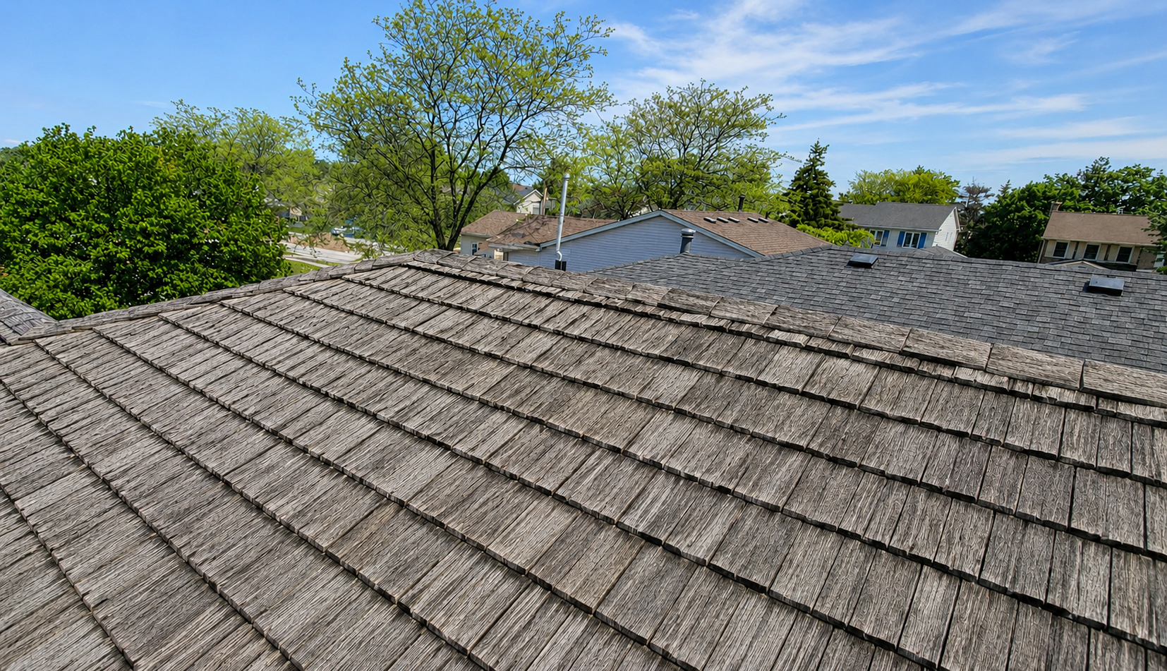 Old cedar shake roof before the RARE Manufacturing Ironwood Shake transformation